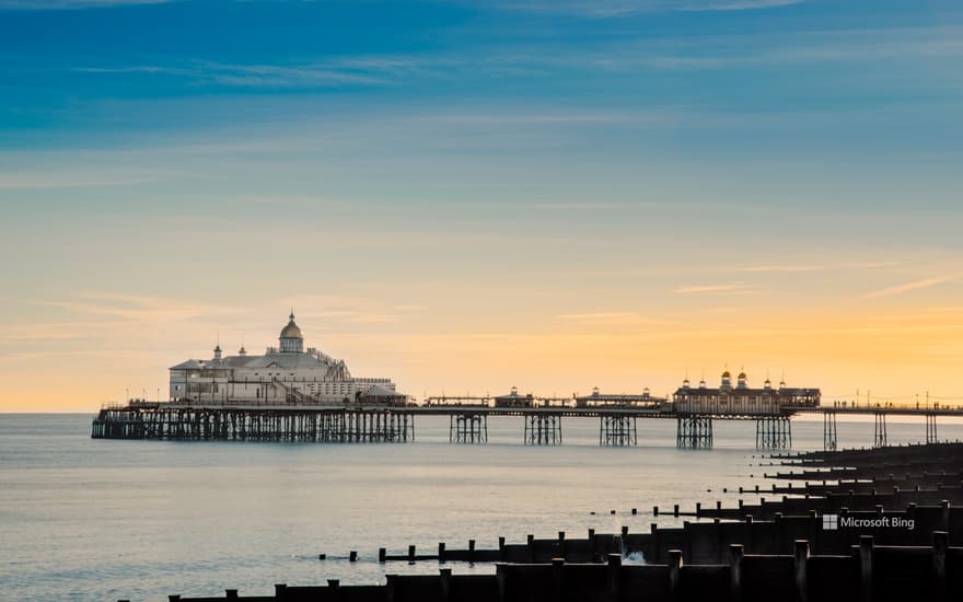 View along the beach to Eastbourne Pier, Eastbourne, East Sussex.